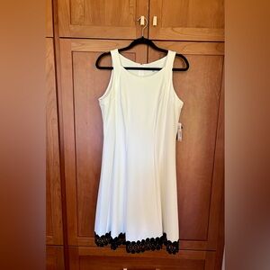 Never worn Sandra Darren white dress with black accenting trim